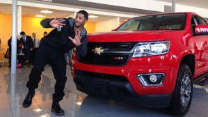New England Patriot's defensive back Malcolm Butler posing with the 2015 Chevrolet Colorado truck given to him by quarterback Tom Brady shortly after Brady had been awarded this truck for being the Super Bowl's Most Valuable Player.